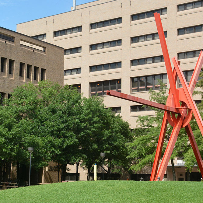 clock knot sculpture in front of engineering teaching center and chemical and petroleum engineering building