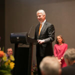 Texas Engineer Sam Dawson stands at a podium to give a speech