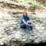 Texas Engineer Savanna Smith sitting on creekbed