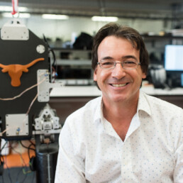 Luis Sentis in his lab in front of his bipedal robot