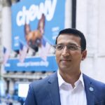 Texas Engineer Sumit Singh in front of Chewy billboard