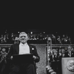 Black and white image of John Goodenough receiving the Nobel Prize in Chemistry
