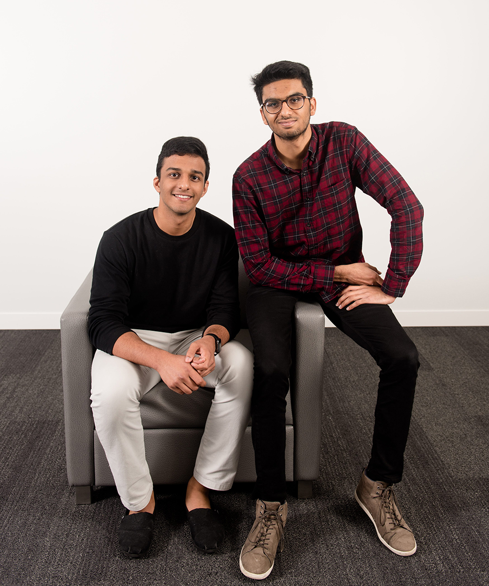 Photo of two students sitting on chair