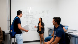 Students collaborate in meeting room in EERC