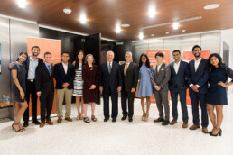 Group photo with students, Dean Sharon Wood, Rex Tillerson, and former UT President Gregory Fenves