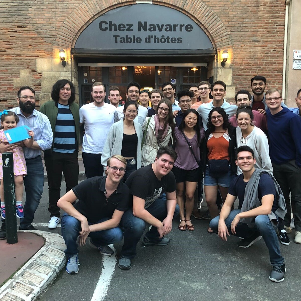 Tom Connolly and Texas Engineering students outside Chez Navarre