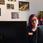 McKinlaye Harkavy smiling at her desk