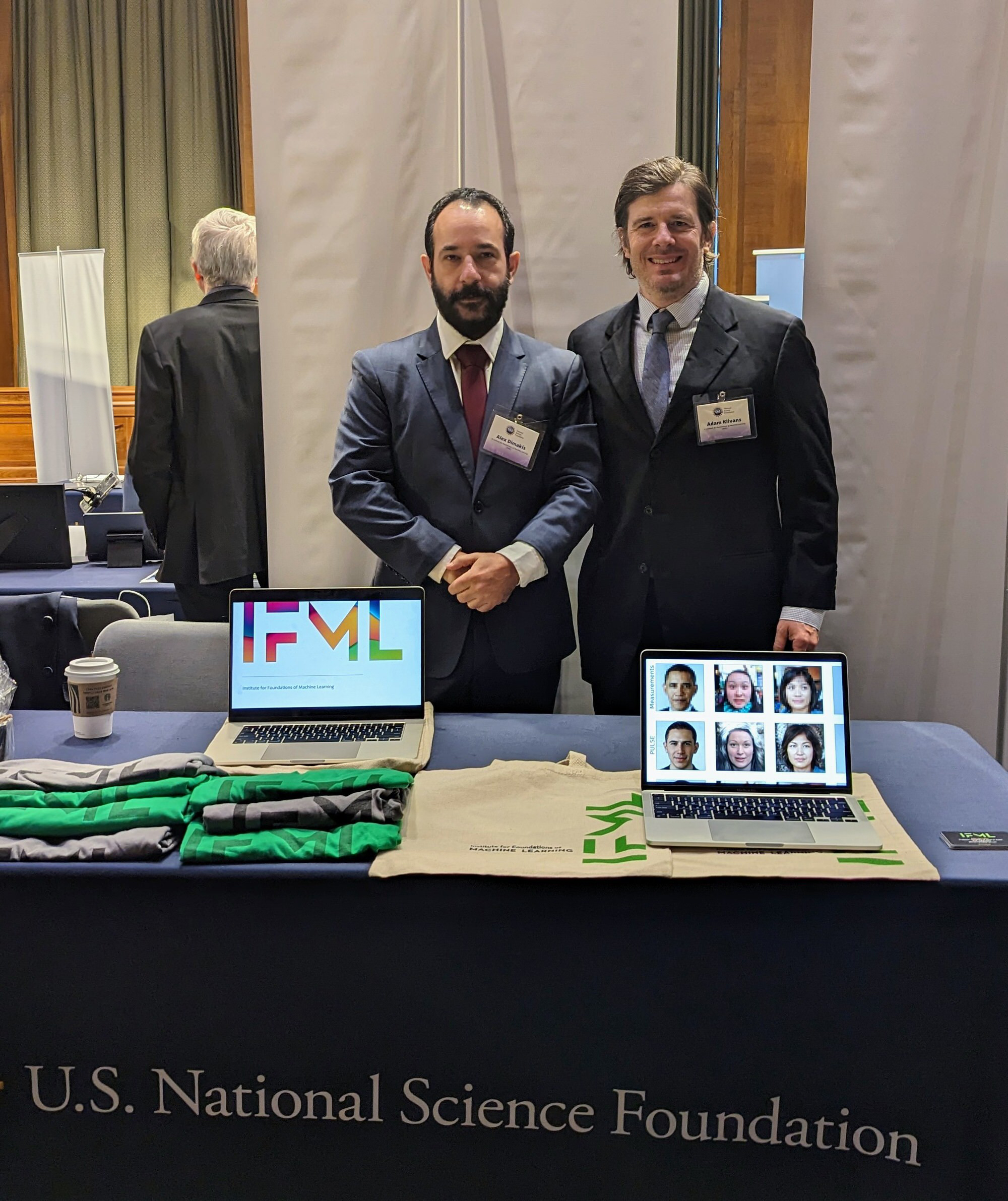 Texas engineering professors Alex Dimakis and Adam Klivans behind National Science Foundation booth