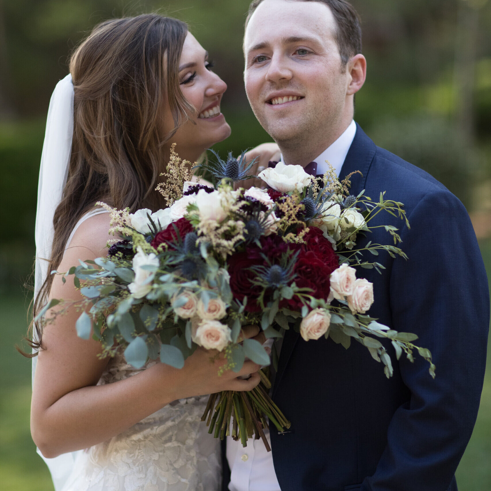 Texas Engineers Elissa Barone and Ryan Perkins smiling at their wedding