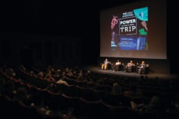 Texas Engineer Michael Webber and panelists sitting on stage for Power Trip show screening