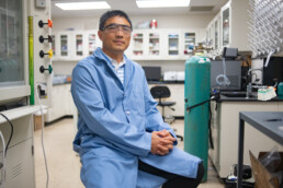 Texas Engineer Guihua Yu siting in his lab