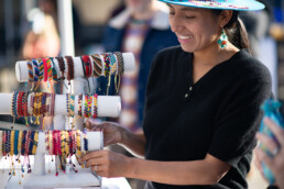 Vargas selling jewelry at farmers market