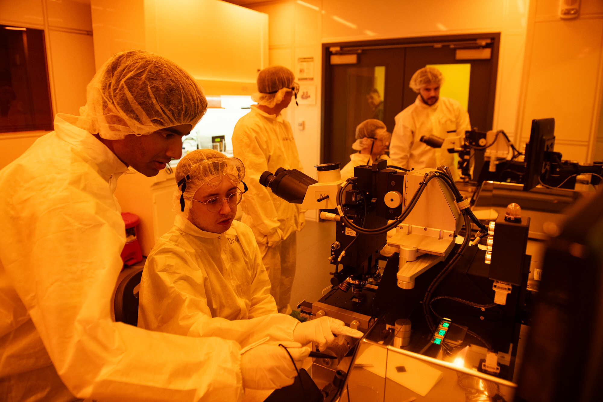 Texas Engineers in lab gear conducting chips research