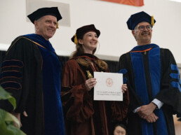 Texas Engineer Ella Small on stage at master's graduation ceremony