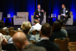 Bard Crabtree and Texas Engineer Arvind Ravikumar speaks on a panel to audience