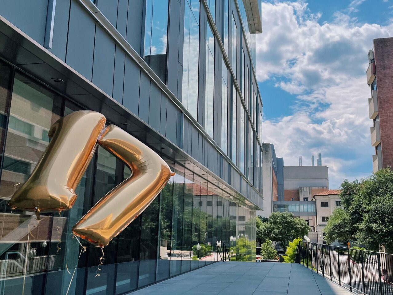 Large numbered 17 balloons floating on UT campus