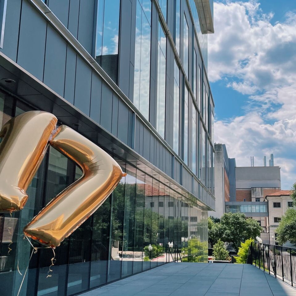 Large numbered 17 balloons floating on UT campus