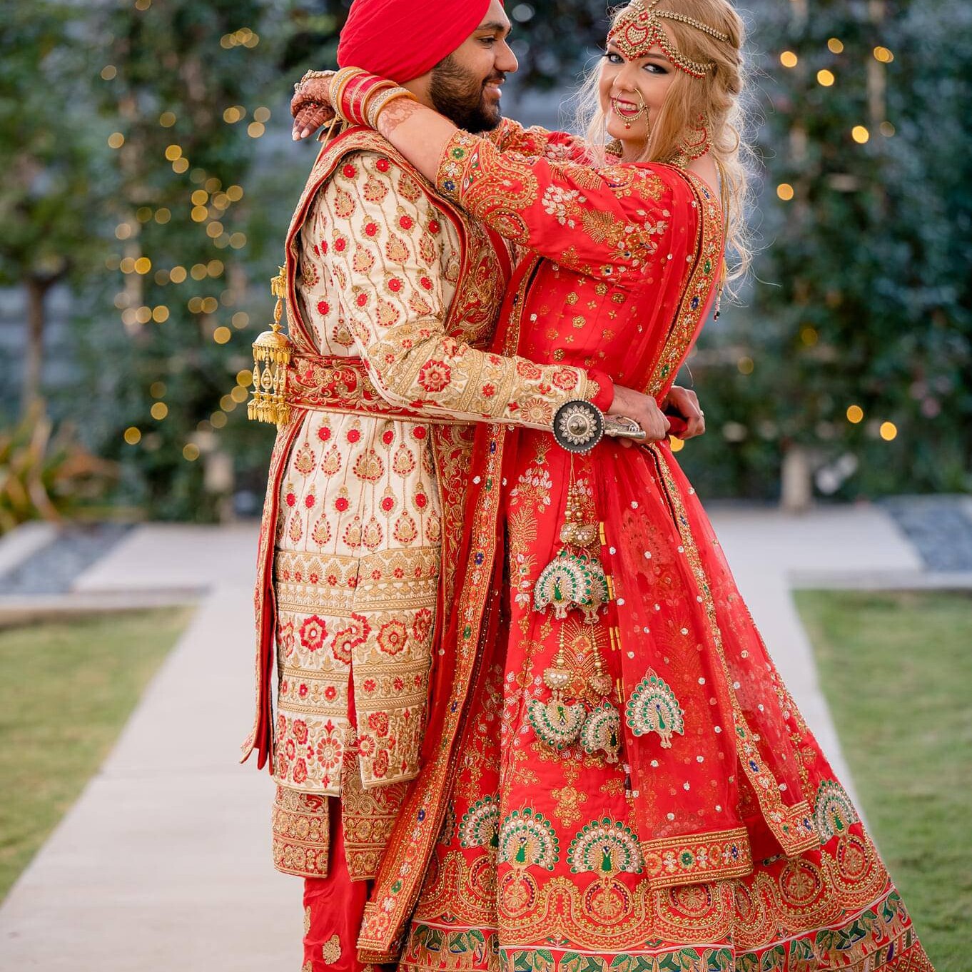 Texas Engineers Kelsea and Amritpreet Kang hugging at their wedding