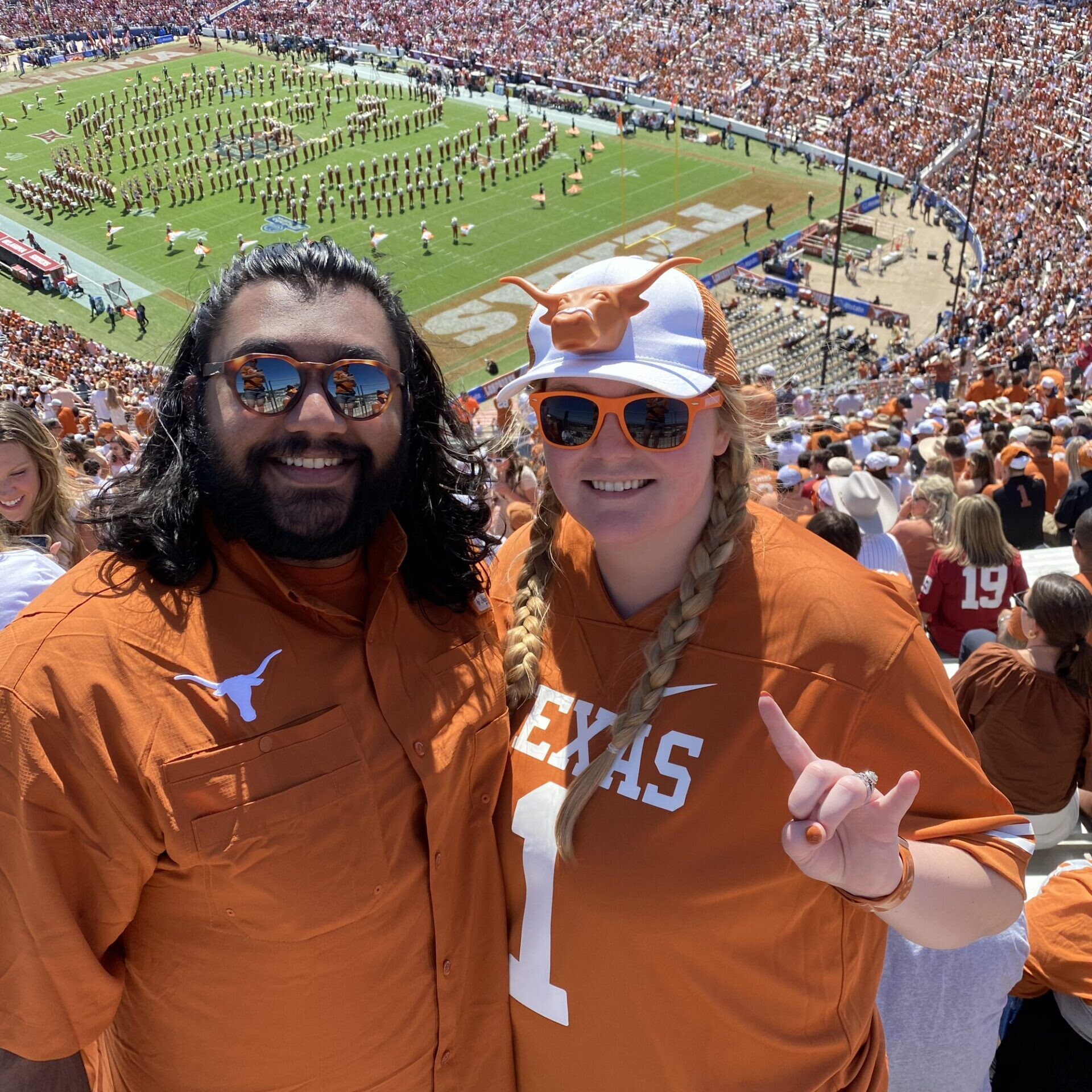 Texas Engineers Kelsea and Amritpreet Kang at UT Austin football game