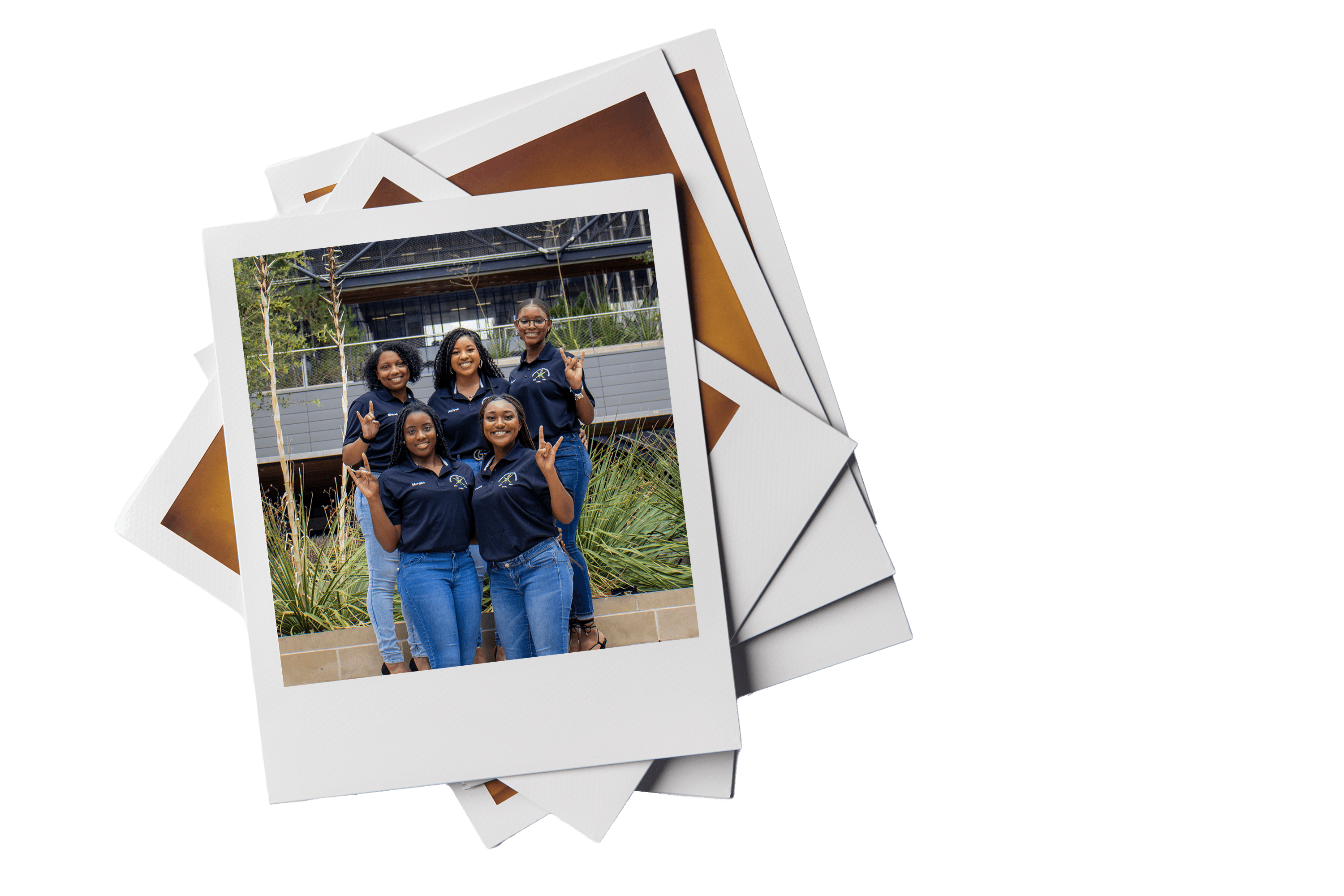 Polaroid of Group of NSBE student leaders smiling and doing hook 'em horns hand sign