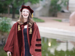 Ella Small smiling in graduation gown