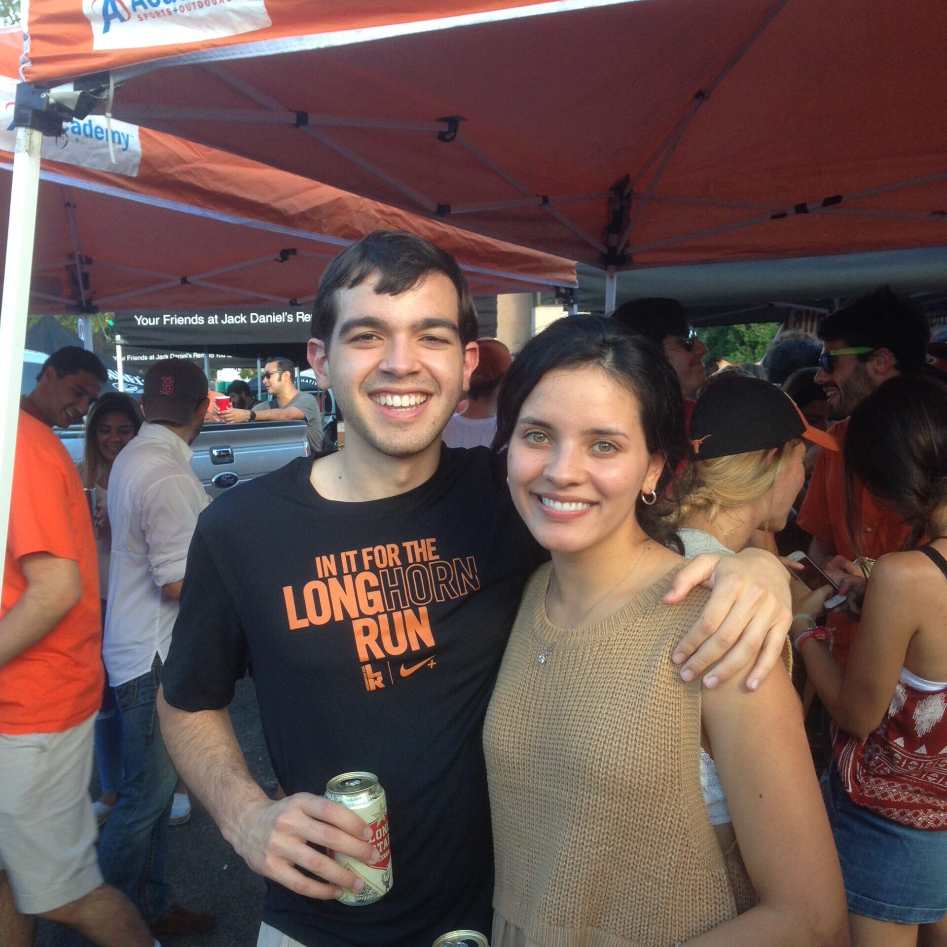 Texas Engineers Laura Rivera and Santiago Echeverri smiling at tailgate