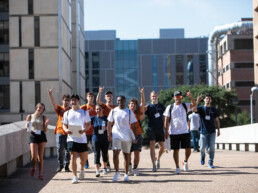 Texas Engineering students walking across bridge on UT Austin campus