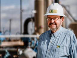 Texas Engineer Autry C. Stephens wearing hardhat at construction site