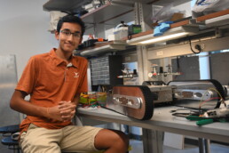 Texas Engineer Siddharth Thakur working on firebot in Texas Inventioworks lab.
