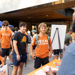 EOE advisor speaking to students at table during 2024 Gone to Engineering