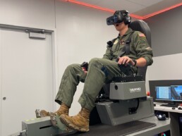Aerospace engineering student and ROTC pilot Jack Lasater demonstrates the new virtual reality flight simulators.