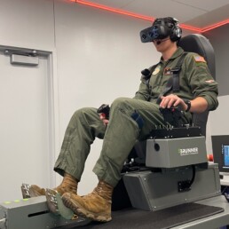 Aerospace engineering student and ROTC pilot Jack Lasater demonstrates the new virtual reality flight simulators.