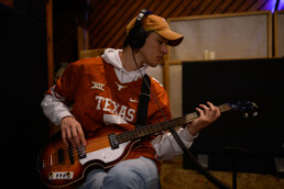 Student guitarist playing in Arlyn Studio
