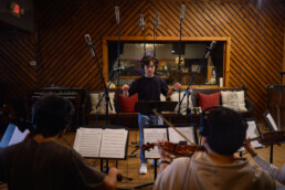 Members of ECho recording a song in Arlyn Studio on campus