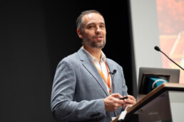 Marco Bravo at podium speaking at UT-Portugal event.