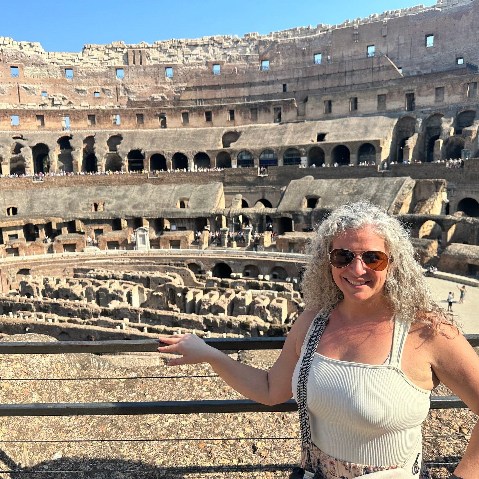 Kiersten Fernandez smiling in front of Parthenon in Greece