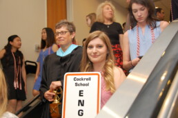 Michele Myer leading students during Commencement in Erwin Center.