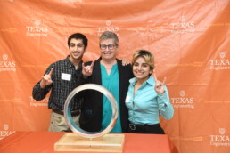 Michele Myer poses with students at the Order of the Engineer ceremony