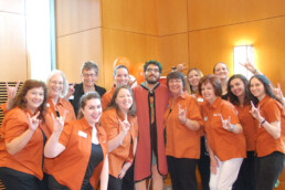 Michele Myer smiling with 2017 ESS staff at team event