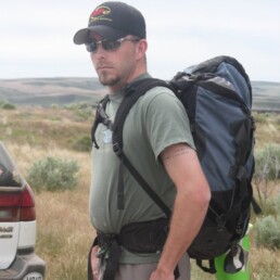 Matt Whitaker wearing backpack for mountain climbing in Utah.